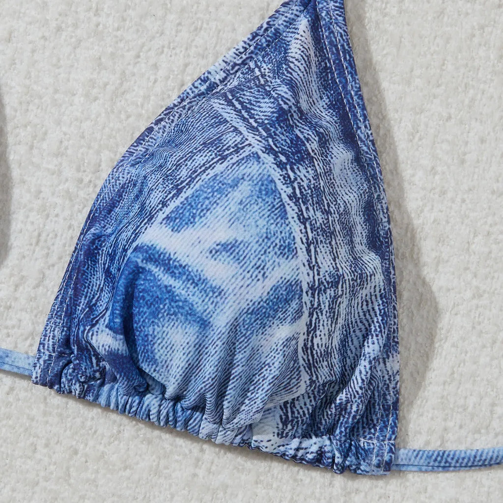Women's denim blue printed bikini set with adjustable straps, shown as a two-piece swimsuit.