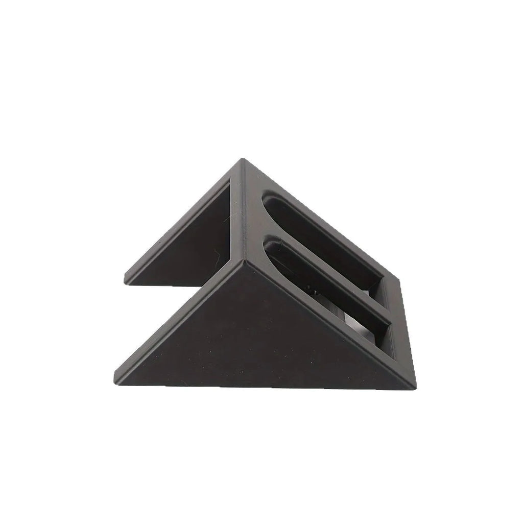 Black punk-style plastic stand for displaying a toy pistol.