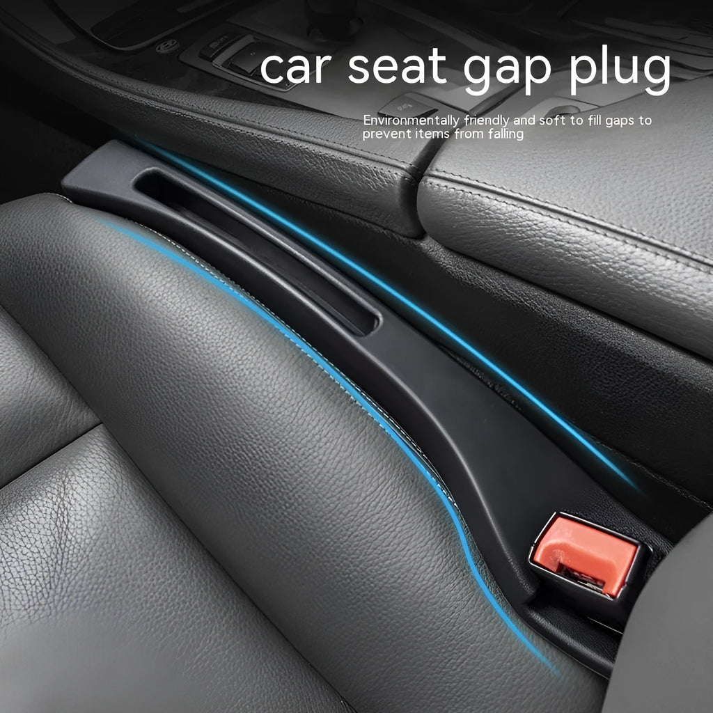 Black plastic car seat gap storage box with removal handle inserted between vehicle seats