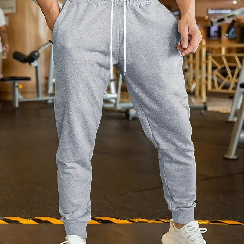 Men's loose-fit casual trousers with elastic lace waistband in a choice of three colours.