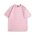 Loose fit half-sleeve round neck t-shirt shown in apricot colour on a hanger.