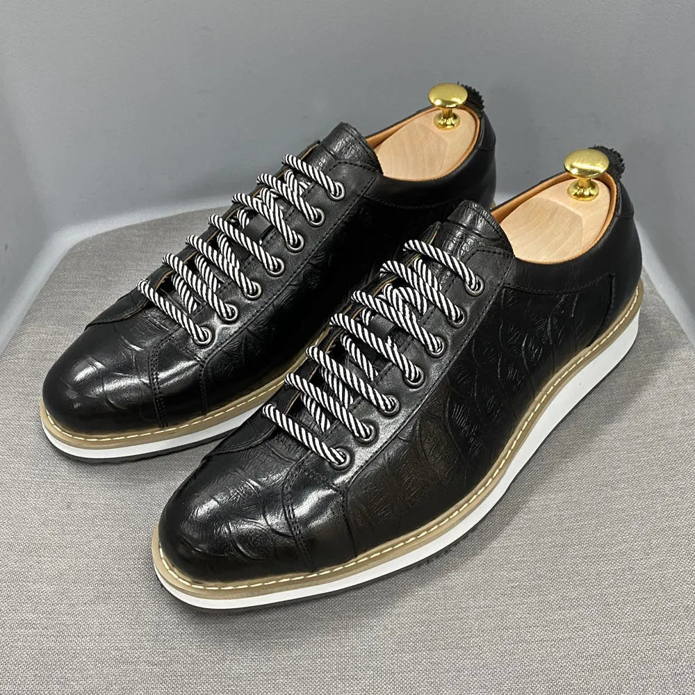 Men's black pattern-embossed handmade low-top shoes with front tie style on a white background.
