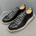 Men's black pattern-embossed handmade low-top shoes with front tie style on a white background.