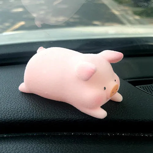 Colourful 3D resin cartoon pig figurine car decoration on a car dashboard