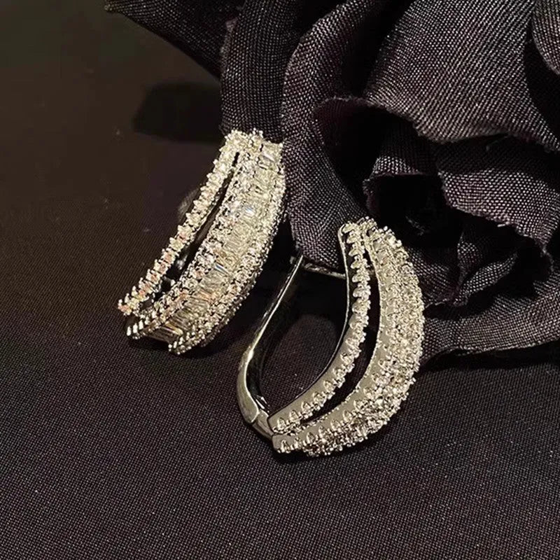 Women's geometric copper stud earrings with inlaid white zircon stones and white gold colour finish