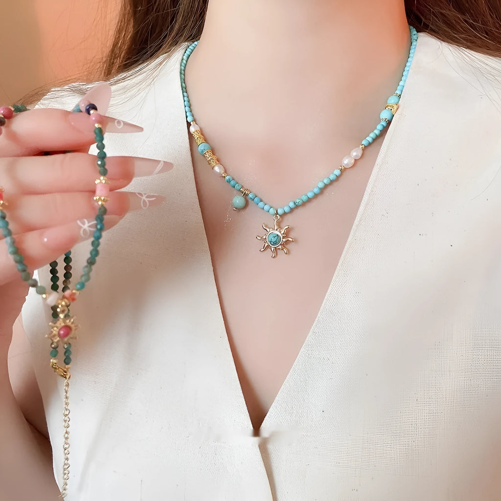 Freshwater pearl necklace with stone sun pendant on adjustable clavicle chain