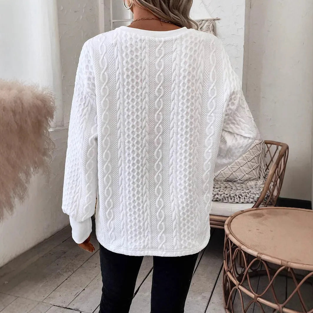 Milky white loose fit casual t-shirt with a raised 3D pattern on the front.