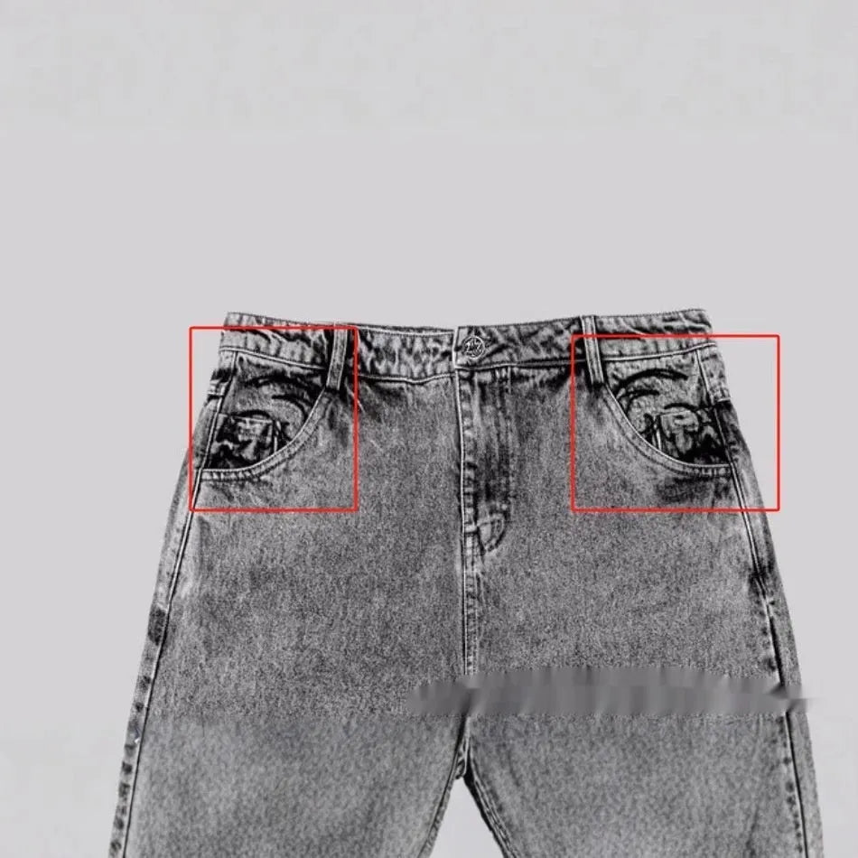 Grey loose straight-leg denim trousers for men and women on a hanger