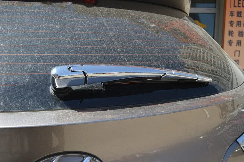 Set of four silvery ABS plastic rear window wiper cover trims for a 2010 Hyundai car.