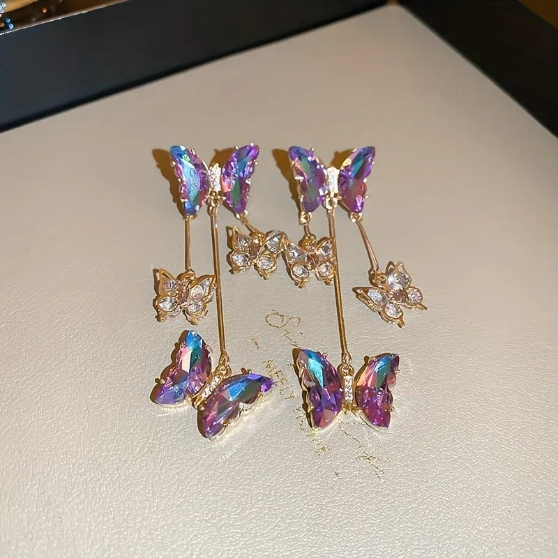 Blue purple alloy drop earrings with crystal flowers, butterfly design and tassel detailing