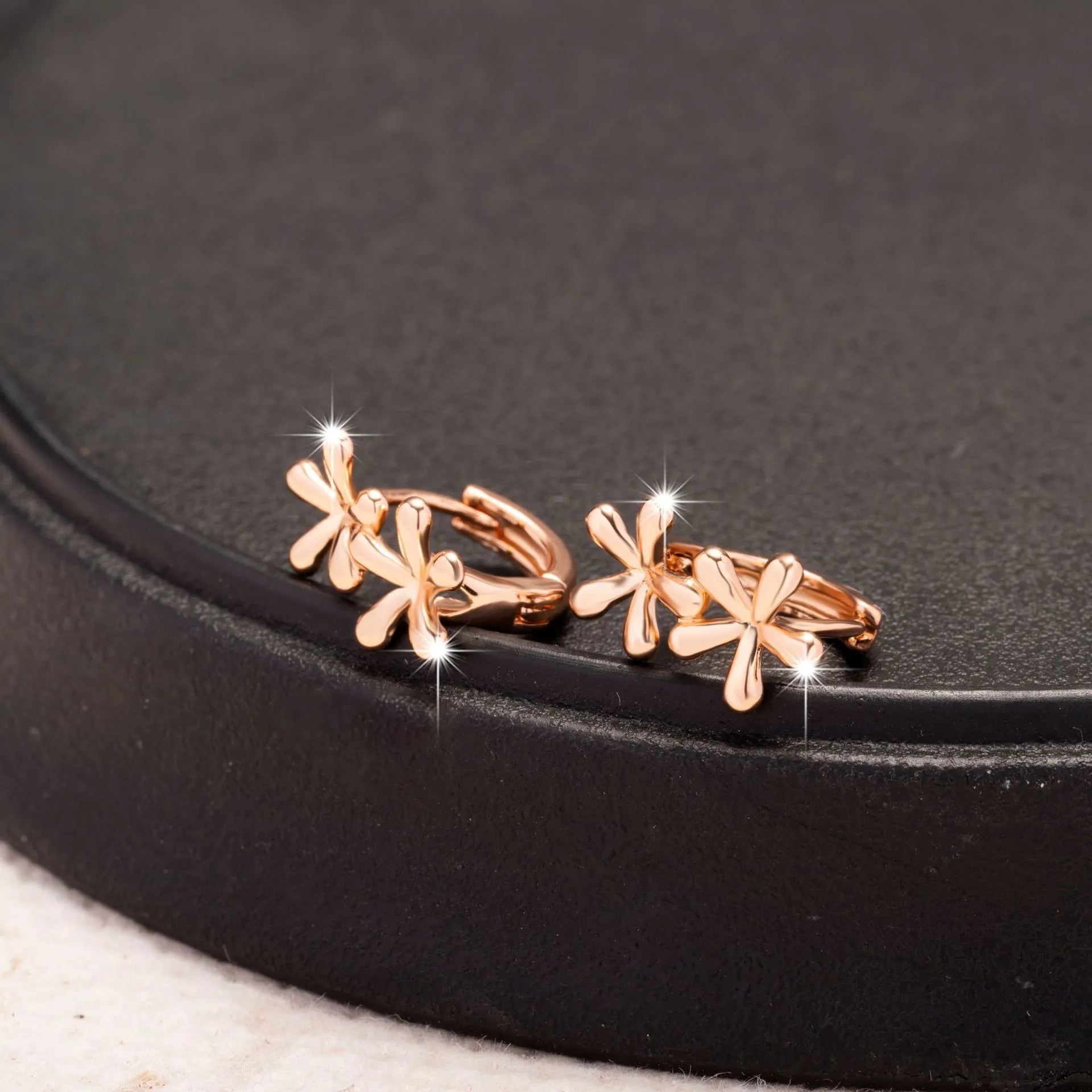 Circular rose gold waterdrop flower earrings with electroplating finish