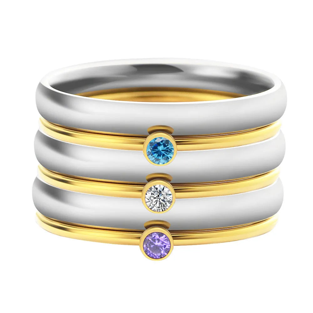 Titanium steel December birthstone ring with electroplated finish, engraved geometry shape, and gold handle.