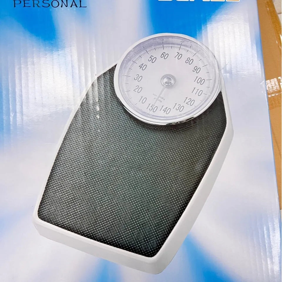 Black mechanical pointer body weight scale with large dial on a 47x35x11cm platform.
