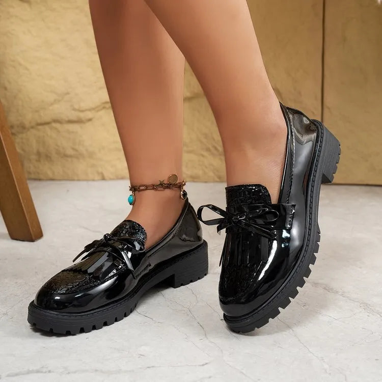 Women's black and brown bow loafers with artificial PU upper, shown in EU sizes 36-43.