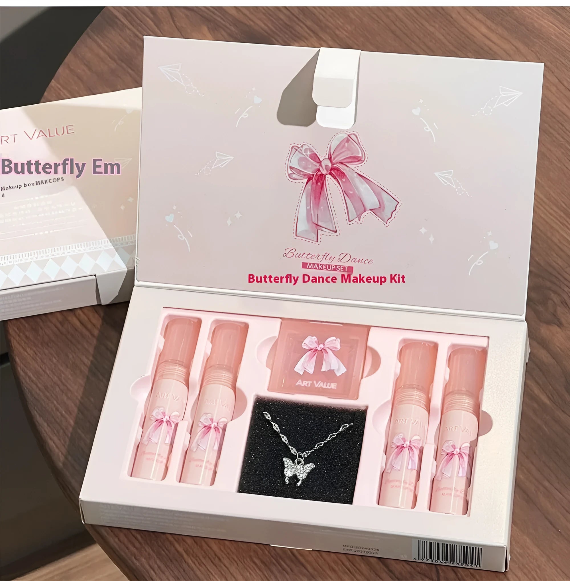 Butterfly box makeup set containing four matte lip mud tubes, powder blusher compact and adjustable necklace