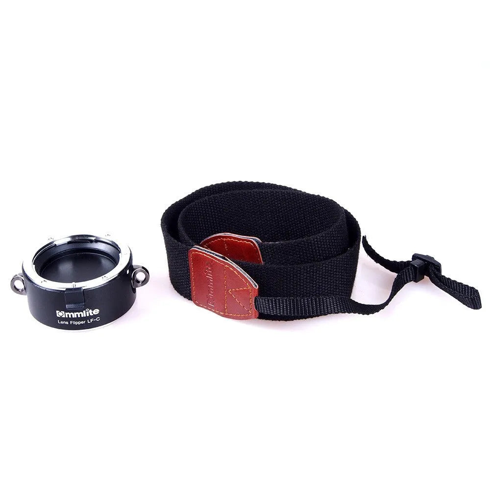Aluminium camera lens flipper holder with cotton strap for quick lens changes on DSLR.
