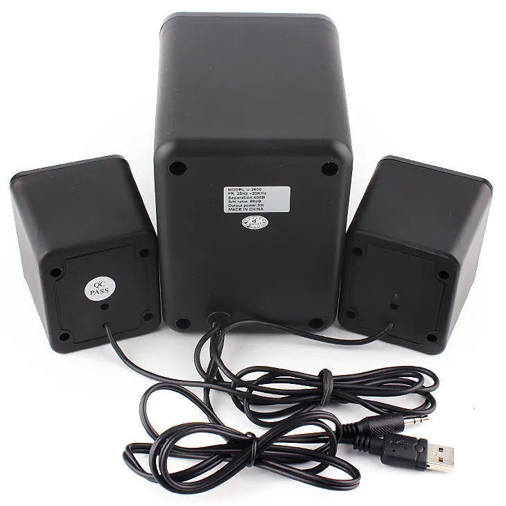 Green U-2600 USB 2.1 mini computer speaker with colourful glowing lights on a desk.