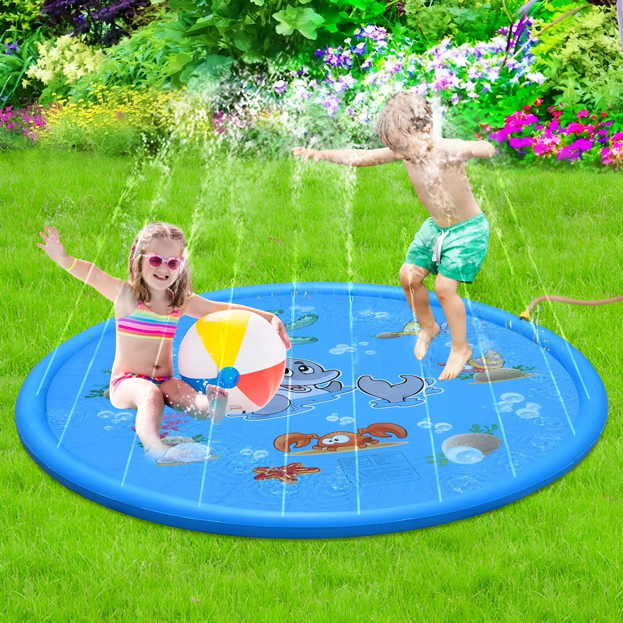 Blue PVC children's water spray play mat with marine animal designs laid out on grass.