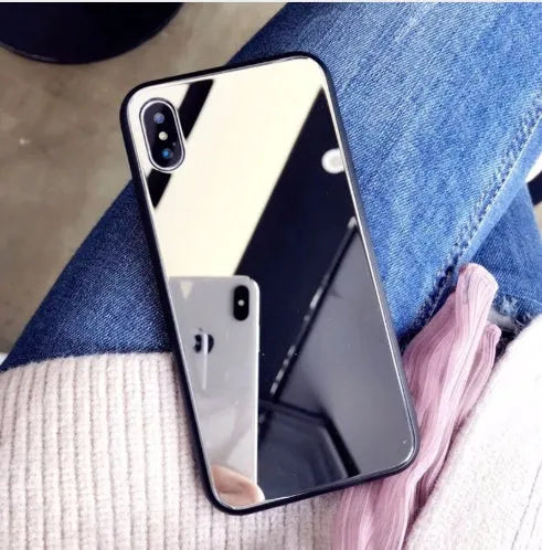 Black iPhone mirror phone case showing reflective back, compatible with iPhone X and 7/8 Plus models.