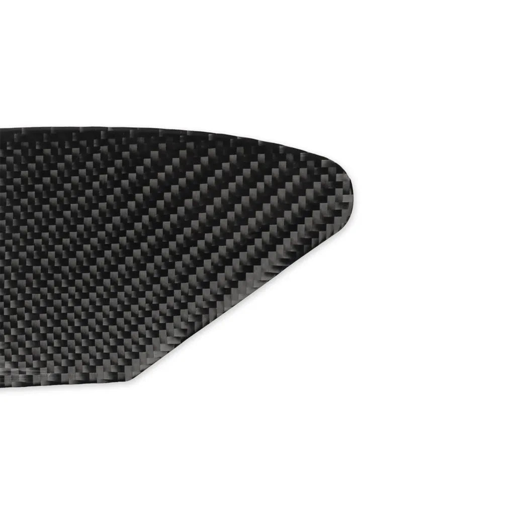 Carbon fibre textured sticker for covering a device charging port panel, showing the 3M adhesive backing.