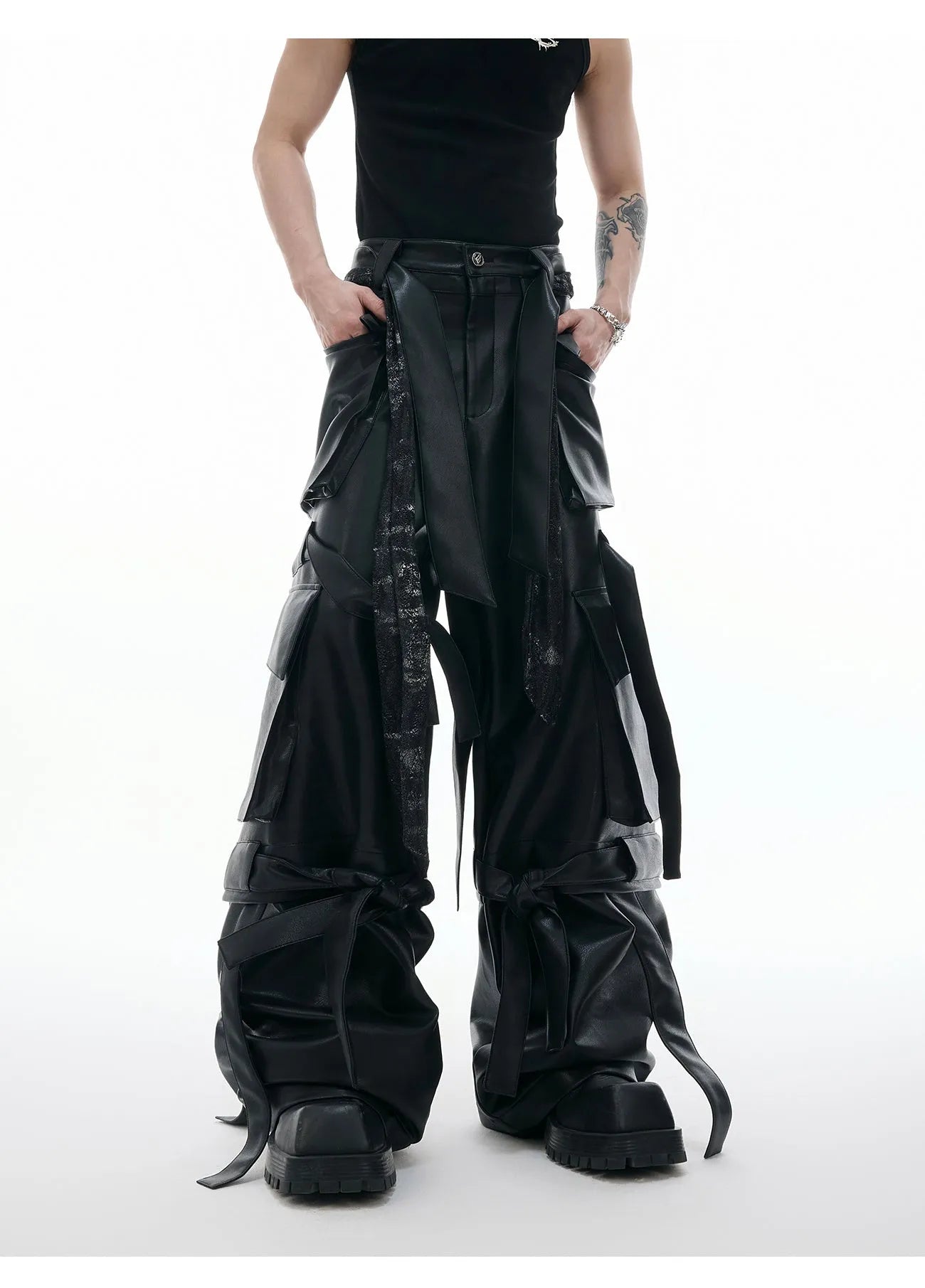 Black loose-fit retro leather pants with quilted panels and multiple pockets.