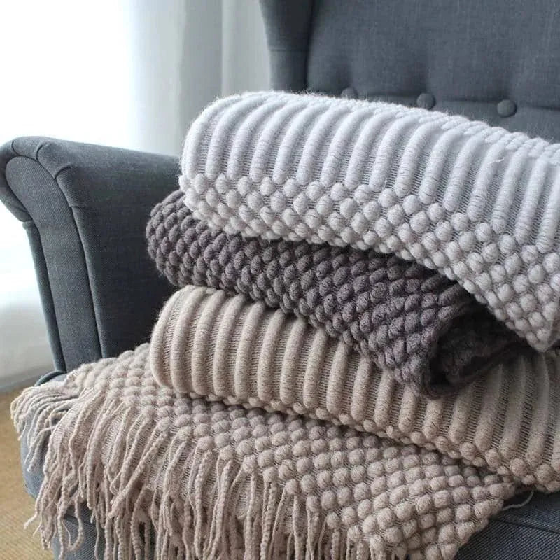 Light grey polyester nap blanket measuring 127cm by 170cm laid flat.
