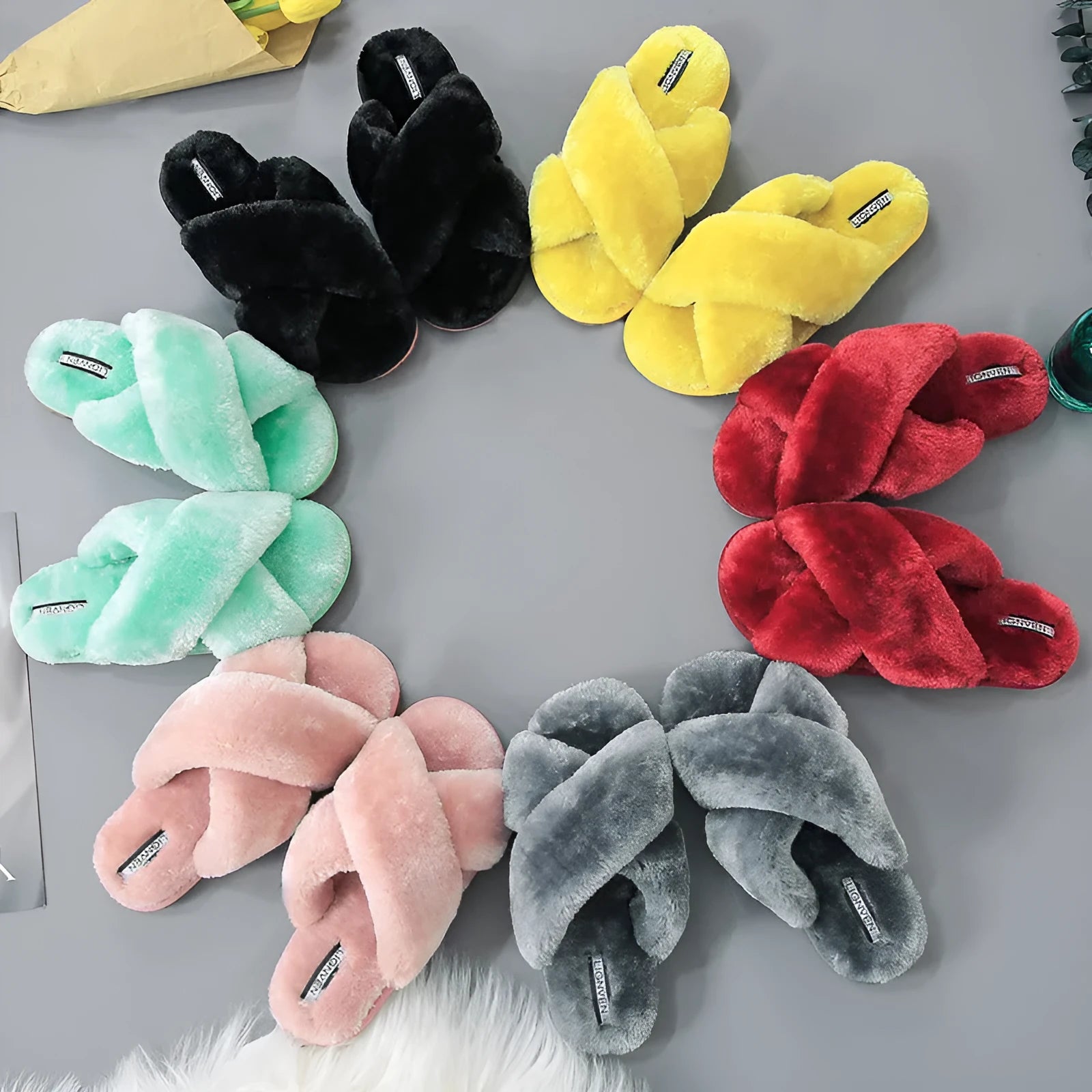 Women's cross open-toe fur slippers in multiple colours on a non-slip patterned sole.