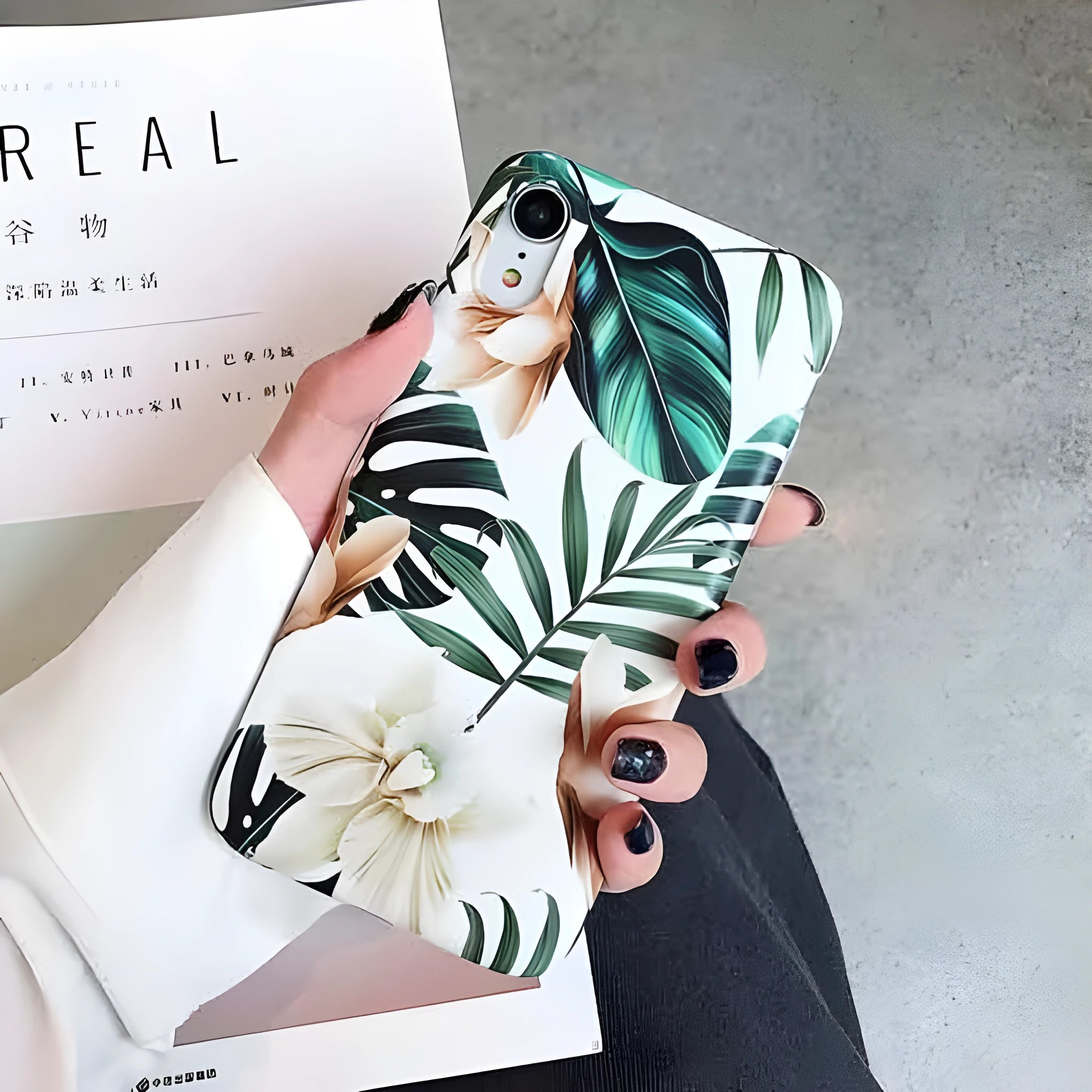 Soft TPU phone case with detailed banana leaf and floral art design for iPhone, shown in flower leaves colour.