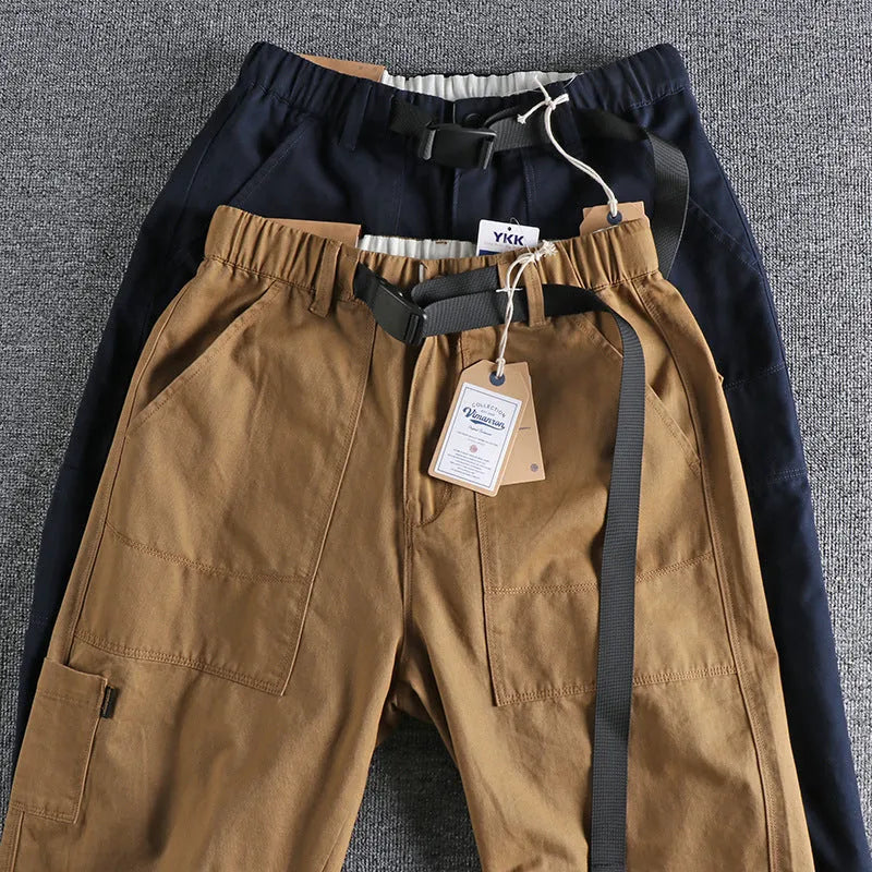 Cotton work trousers with N I buckle belt in khaki or dark blue colours showing three-dimensional cutting design