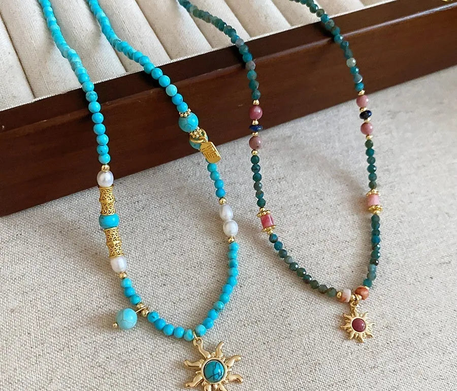 Freshwater pearl necklace with stone sun pendant on adjustable clavicle chain