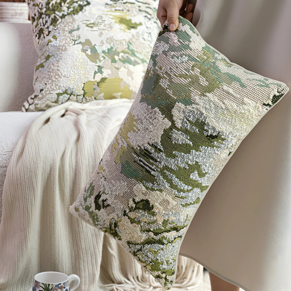Green abstract floral pattern on a square wool blend decorative cushion pillow.