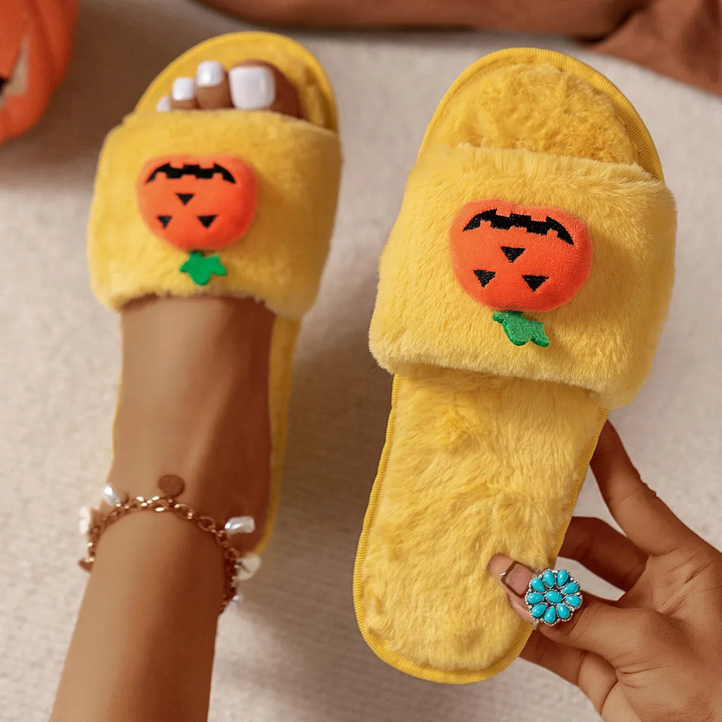 Yellow Halloween pumpkin cartoon design open toe slippers with soft synthetic fur upper.
