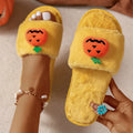 Yellow Halloween pumpkin cartoon design open toe slippers with soft synthetic fur upper.