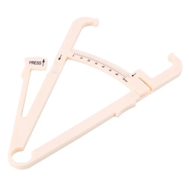 Clear acrylic body fat caliper skin fold thickness meter showing measurement scale