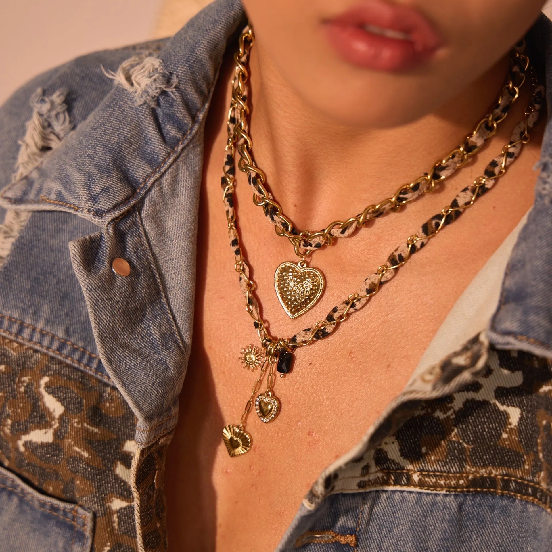 Stainless steel geometric leopard love pendant necklace with electroplated 18K finish on adjustable chain
