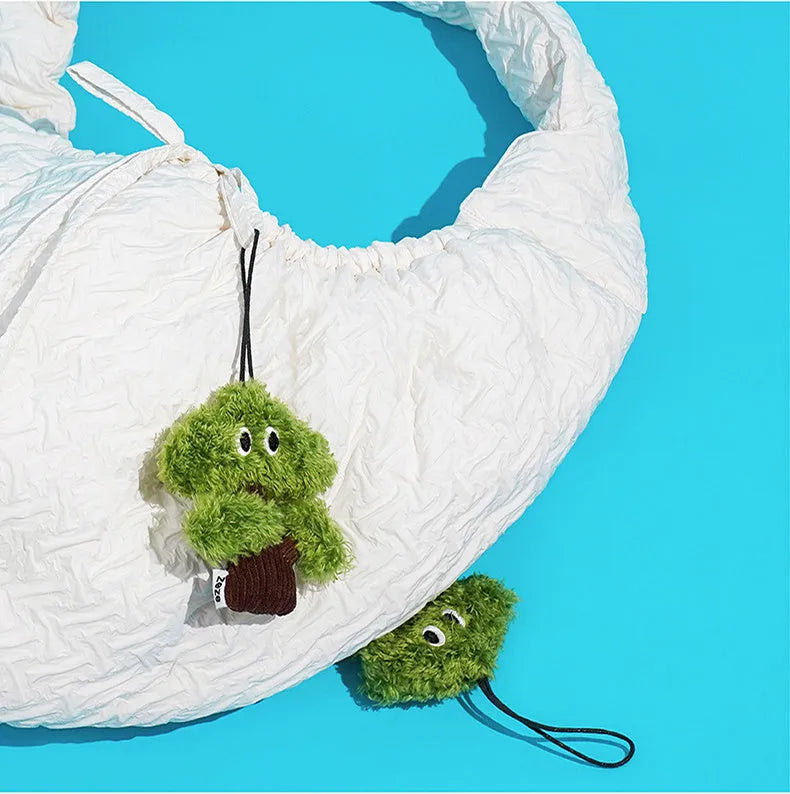 Pine tree shaped cat chew toy pendant that doubles as a tease stick.