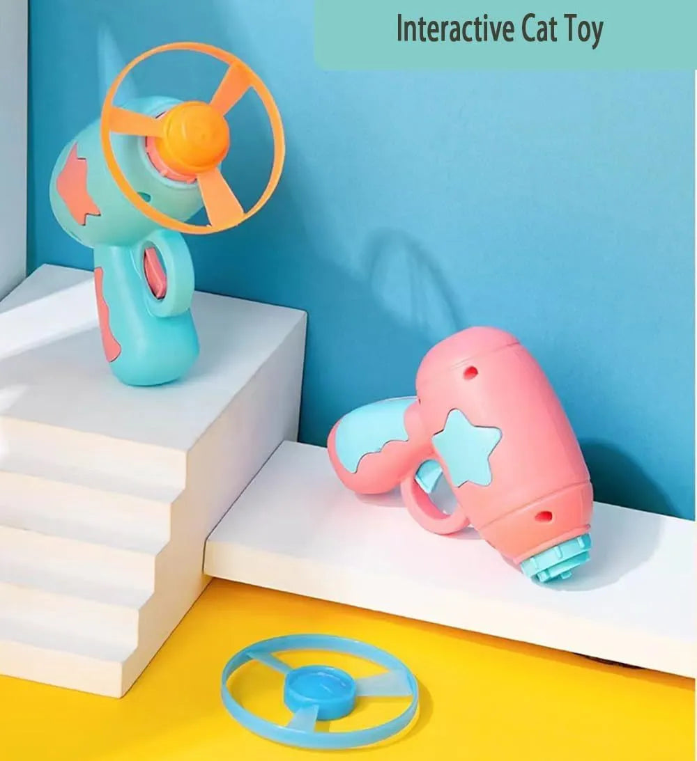 Blue plastic cat toy gun with frisbee launcher for indoor cats on white background