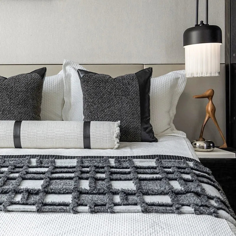 Modern minimalist grey and white plaid bed runner set with leather round pillow on a 1.5m-1.8m bed