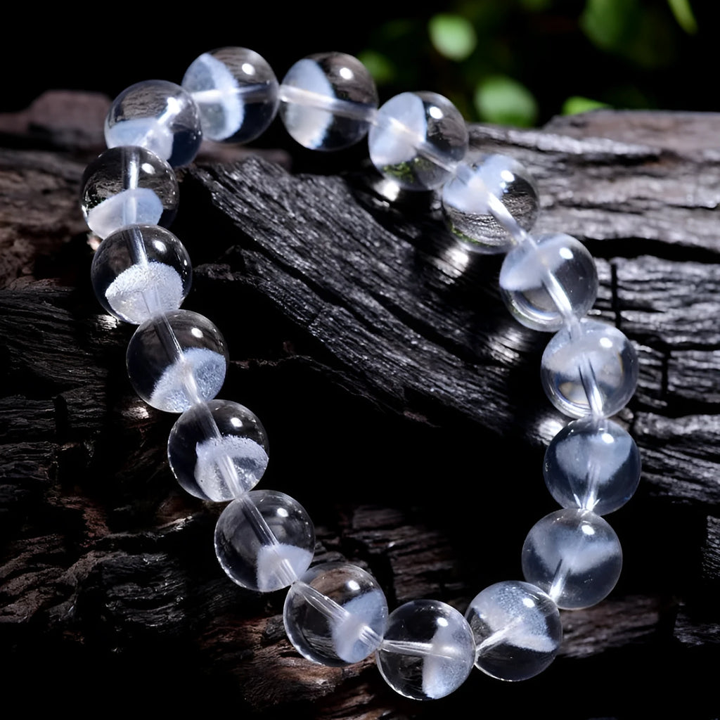 Women's white crystal pyramid bead bracelet with Ruyi element on wrist