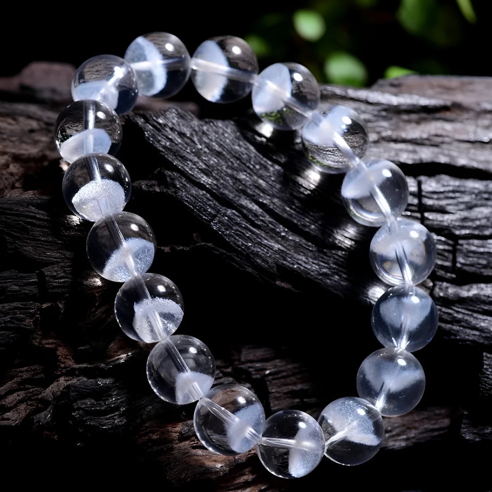 Women's white crystal pyramid bead bracelet with Ruyi element on wrist
