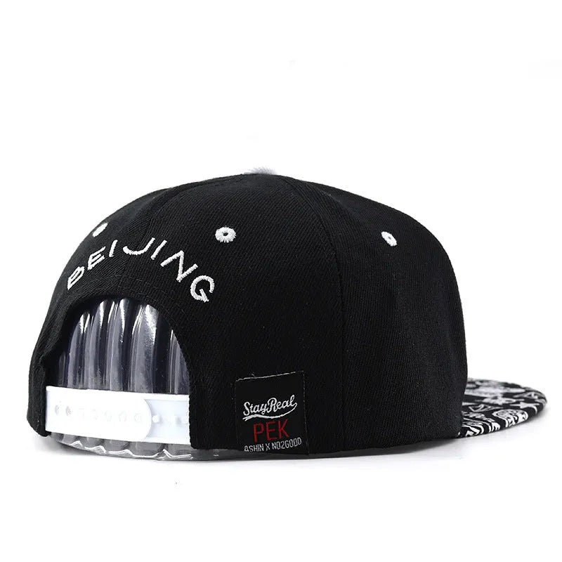 Cotton baseball cap with letter embroidery in black colour showing adjustable strap