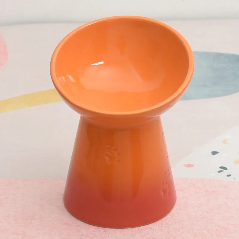 High-foot ceramic pet bowl with chin protector and anti-tumble base design