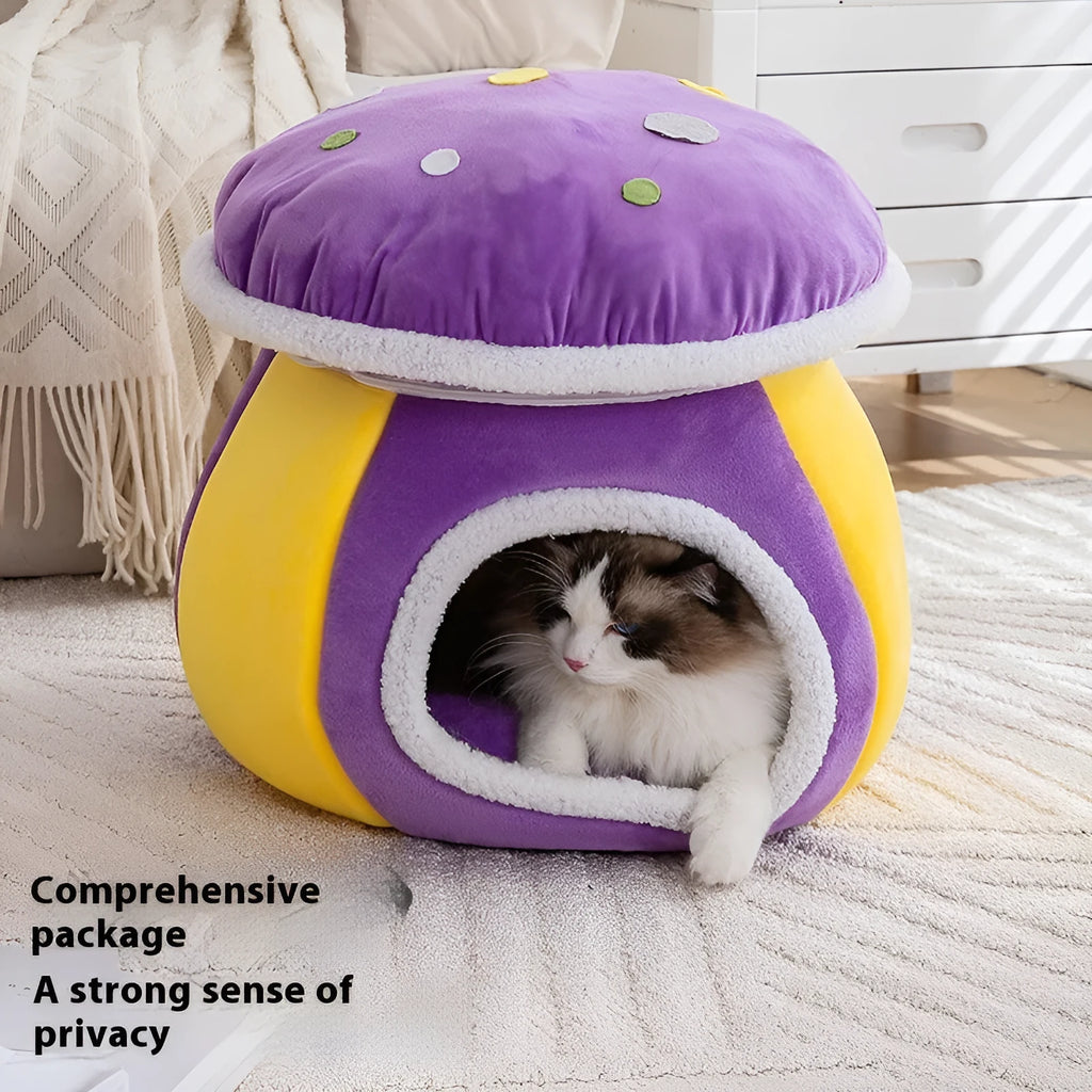 Grey mushroom-shaped plush cat bed on a wooden floor.