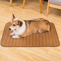 Brown rattan fibre cooling mat for dogs on a wooden floor