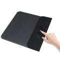 Foldable cloth phone holder with wireless charging pad showing fabric surface and compact folded design
