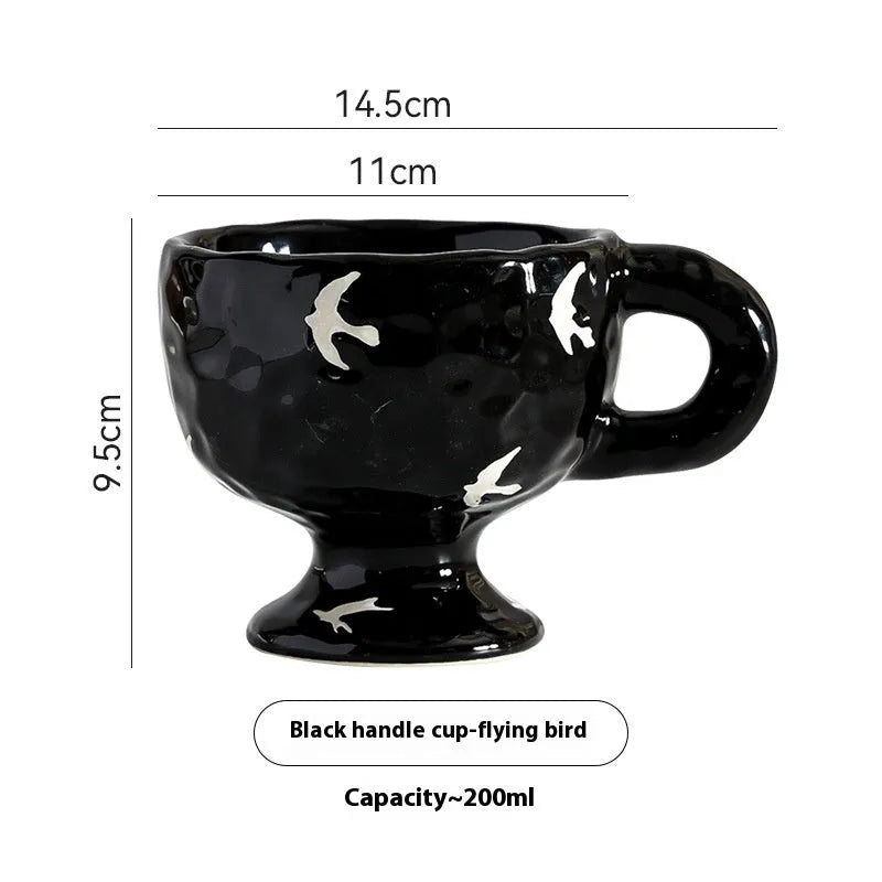 A handmade, irregularly shaped ceramic mug in a solid colour, shown on a table.