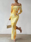 Woman wearing a printed gradient colour mesh fishtail dress with pleats and a square collar