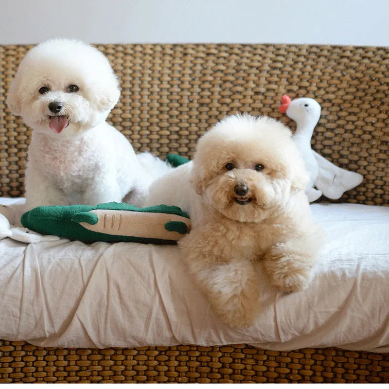 Green plush toy dog stuffed animal on a white background.