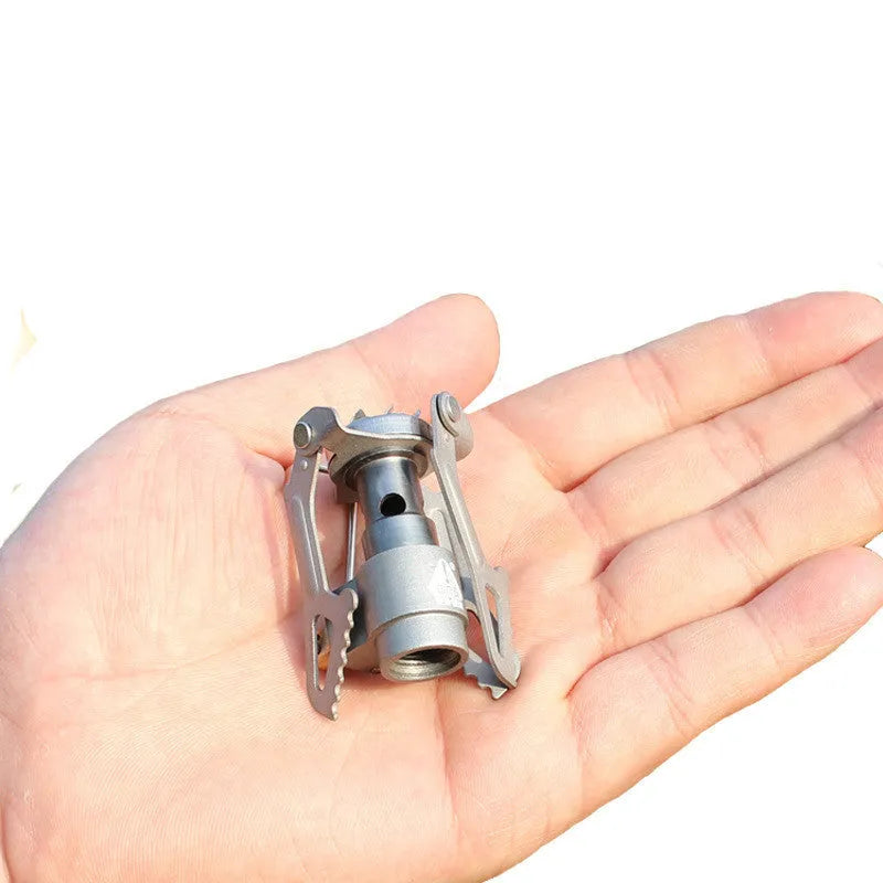 Portable propane gas camping stove with one-piece furnace construction for outdoor use