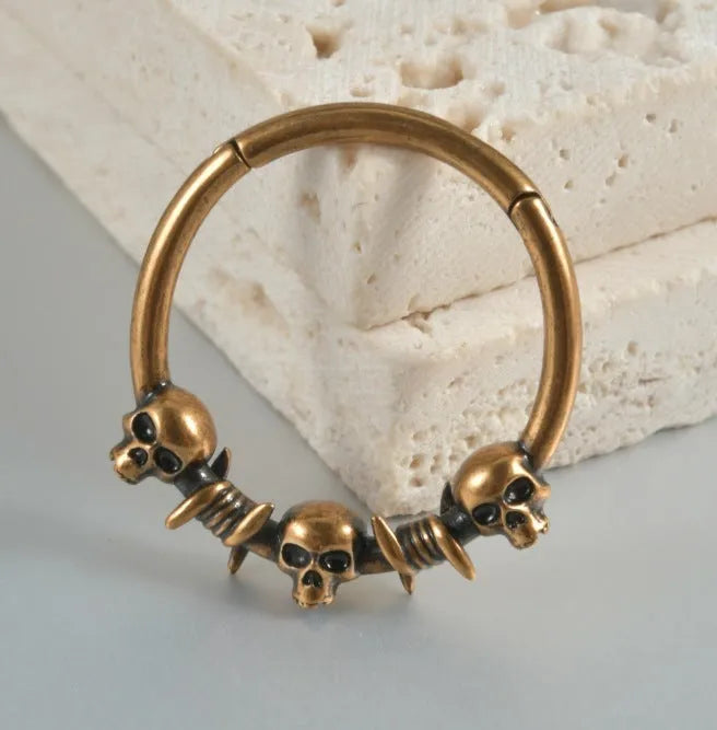 Copper punk earrings with ghost head motifs in antique gold or silver finish